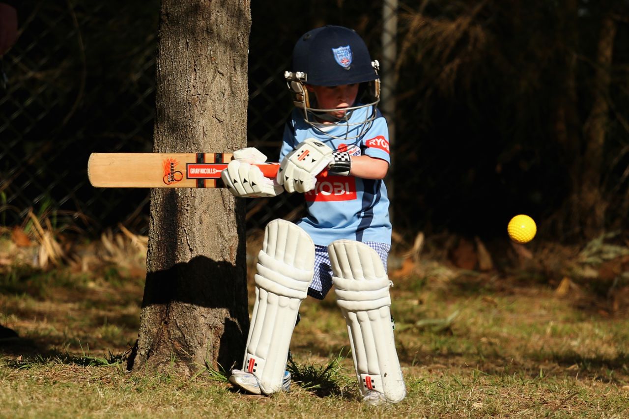 A kid plays wearing pads and helmet, New South Wales v Tasmania, Ryobi Cup, Sydney, September 29, 2013 