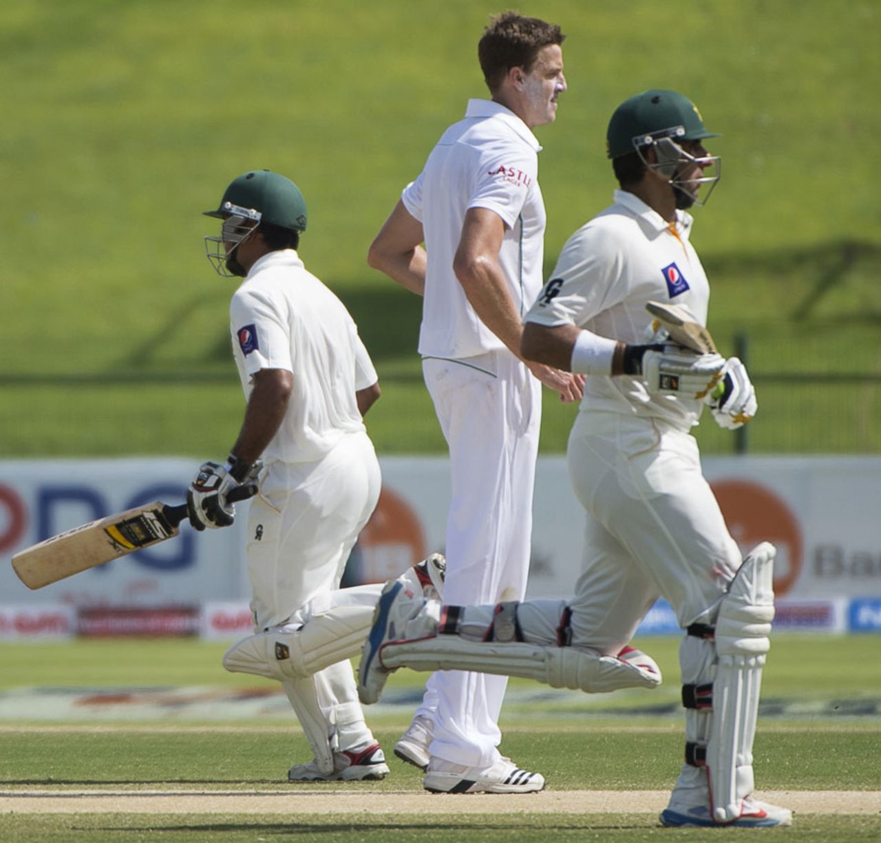 Misbah-ul-Haq and Asad Shafiq take a single as Morne Morkel looks on, Pakistan v South Africa, 1st Test, 3rd day, Abu Dhabi, October 16, 2013
