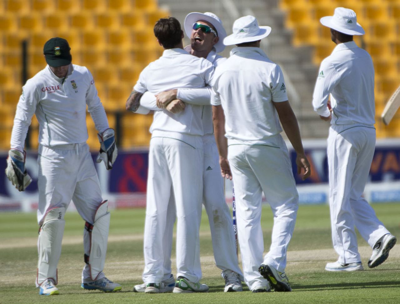 Graeme Smith celebrates Misbah-ul-Haq's wicket with his team-mates, Pakistan v South Africa, 1st Test, 3rd day, Abu Dhabi, October 16, 2013
