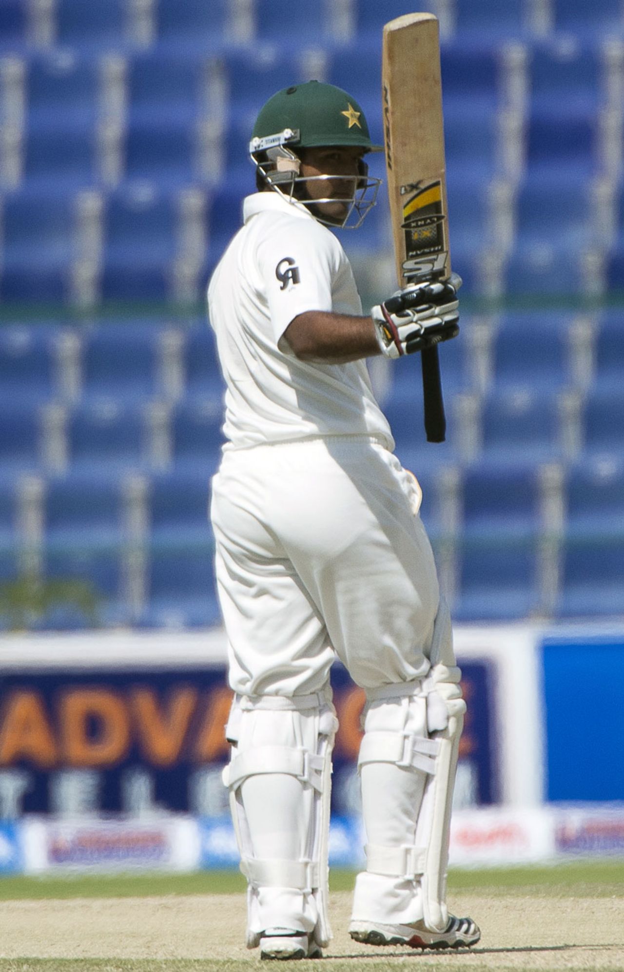 Asad Shafiq raises his bat after scoring a half-century, Pakistan v South Africa, 1st Test, 3rd day, Abu Dhabi, October 16, 2013