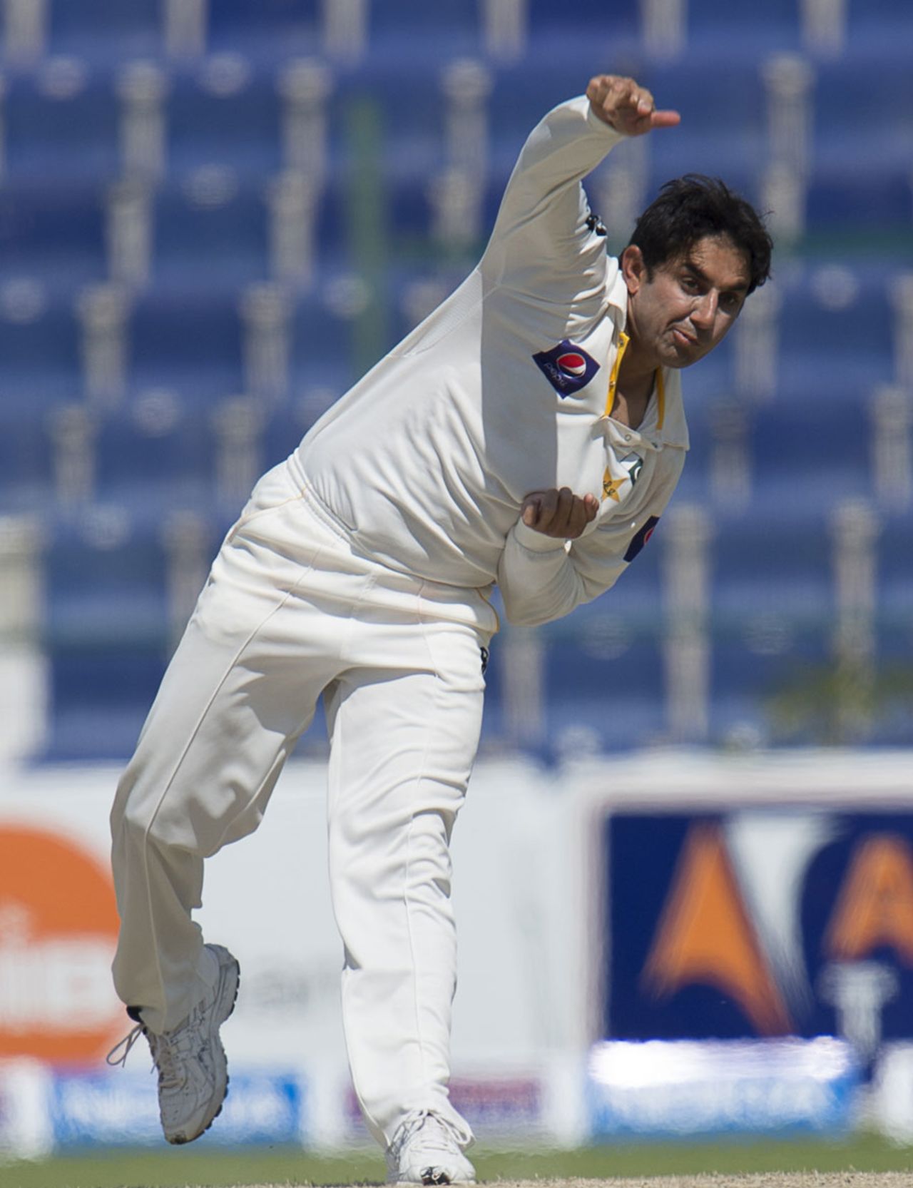 Saeed Ajmal completes his bowling action, Pakistan v South Africa, 1st Test, 4th day, Abu Dhabi, October 17, 2013