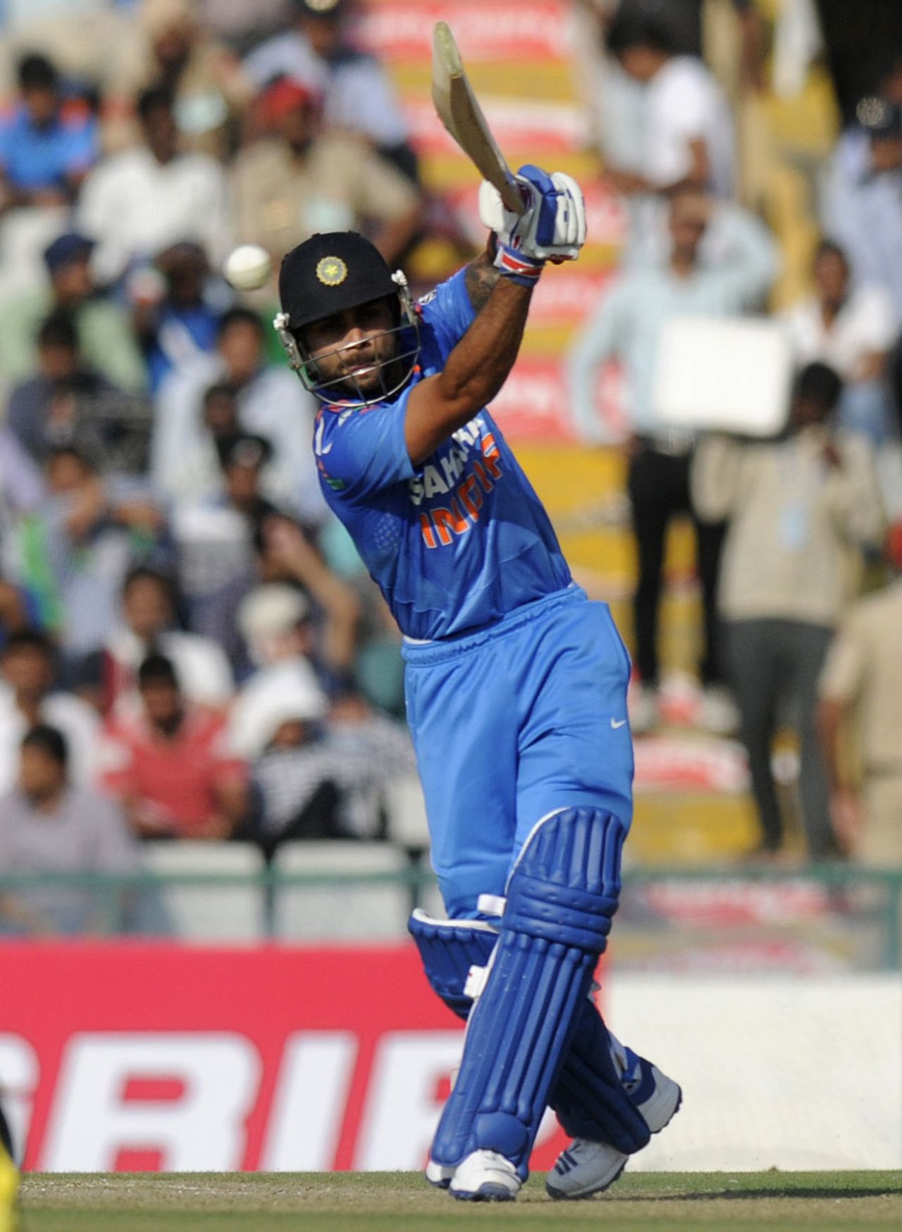 Virat Kohli drives the ball through the off side, India v Australia, 3rd ODI, Mohali, October 19, 2013