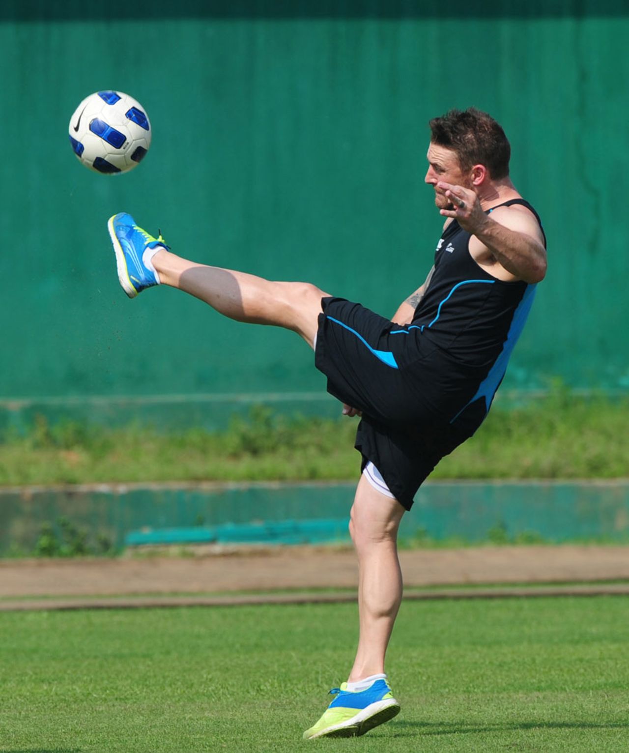 Brendon McCullum plays football during a training session, Dhaka, October 19, 2013