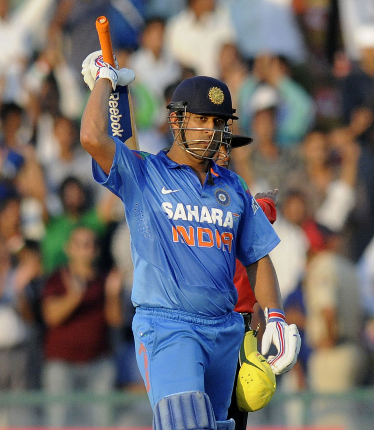 MS Dhoni acknowledges the applause after scoring his ninth ODI hundred, India v Australia, 3rd ODI, Mohali, October 19, 2013