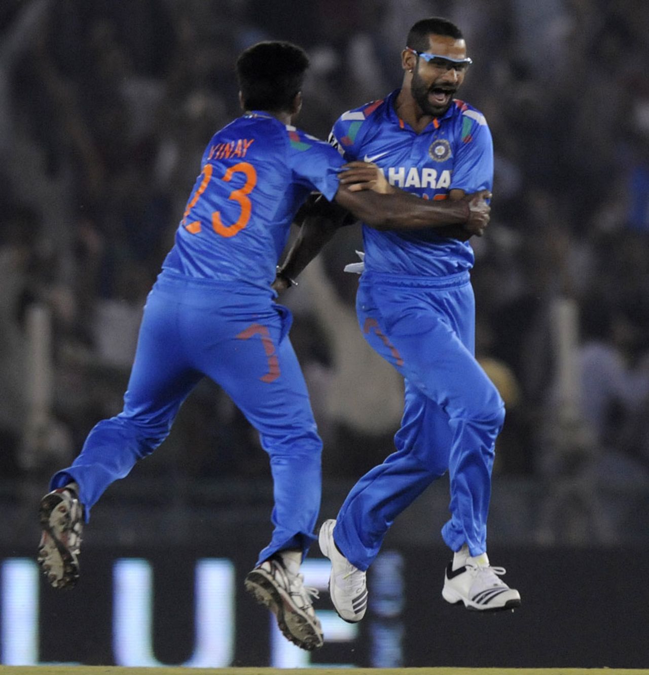 Vinay Kumar and Shikhar Dhawan celebrate Glenn Maxwell's run-out,  India v Australia, 3rd ODI, Mohali, October 19, 2013