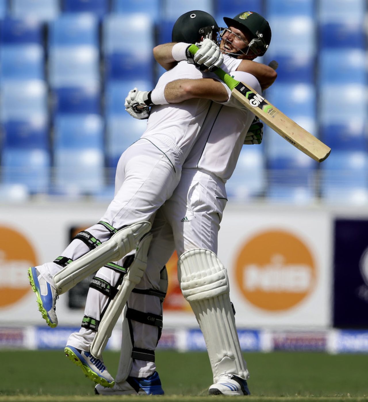 Graeme Smith celebrates his ton with AB de Villiers, Pakistan v South Africa, 2nd Test, Dubai, 2nd day, October 24, 2013