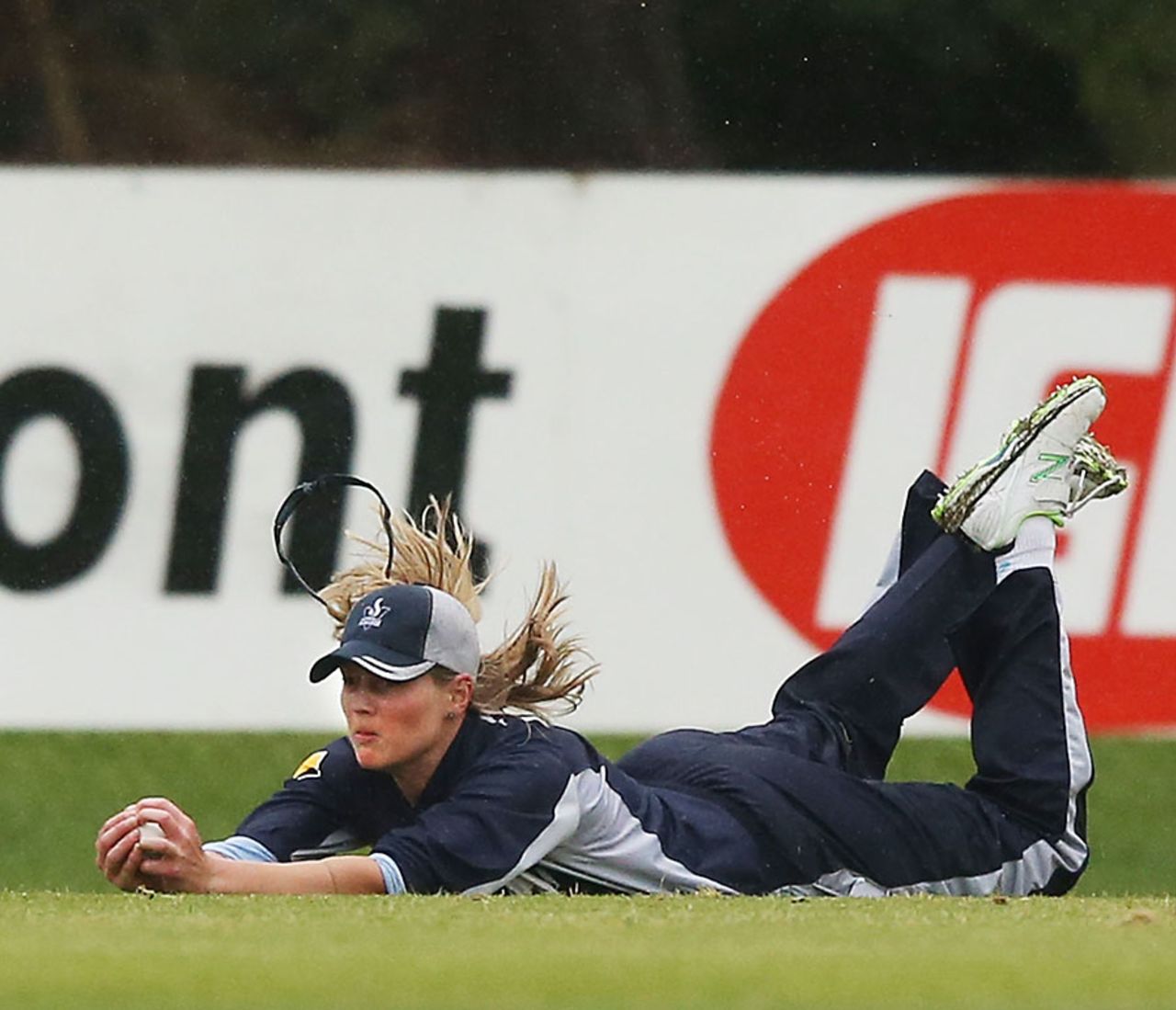 Meg Lanning dives full length to take a catch, Victoria v ACT, Russell Lucas Oval, Melbourne, October 25, 2013