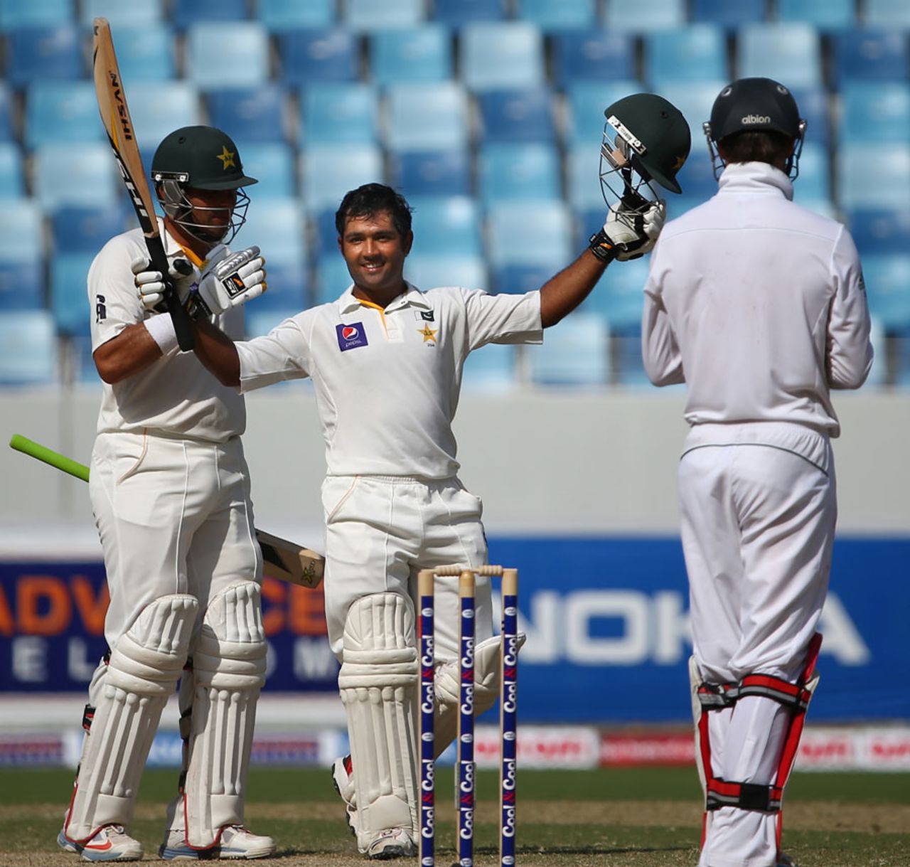 Asad Shafiq raises his bat after reaching his century, Pakistan v South Africa, 2nd Test, Dubai, 4th day, October 26, 2013
