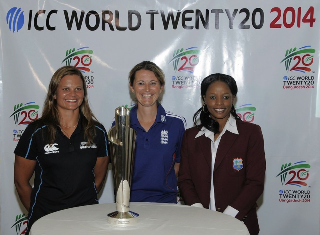 Charlotte Edwards, Suzie Bates and Merissa Aguilleira pose with the World T20 trophy, Bridgetown, October 25, 2013