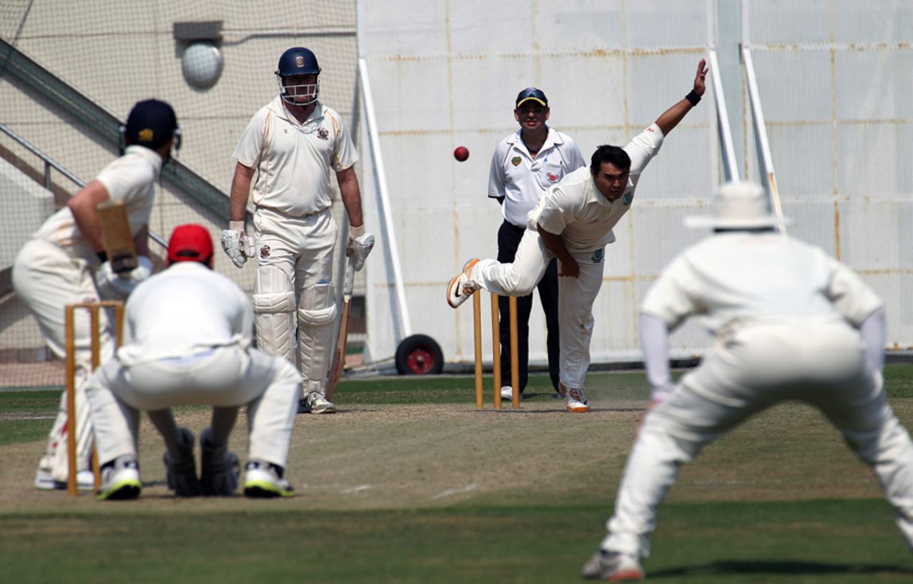 KCC's Roy Lamsam bowling in the 2013 Fincher Shield at Kowloon Cricket Club, 26-27th October 2013