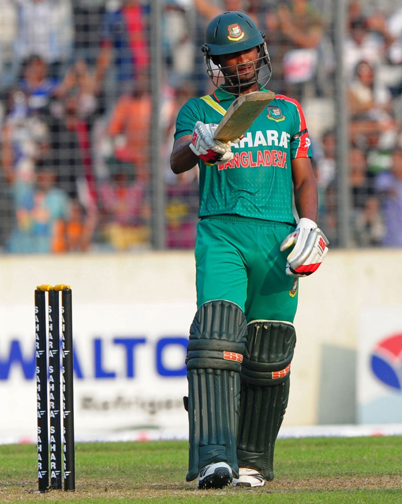 Naeem Islam celebrates his half-century, Bangladesh v New Zealand, 1st ODI, Mirpur, October 29, 2013