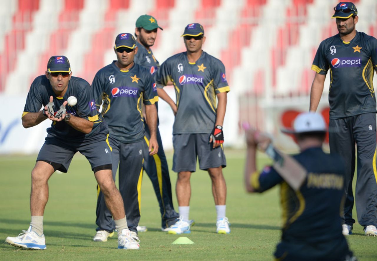 Misbah-ul-Haq catches the ball during a training session, Sharjah, October 29, 2013