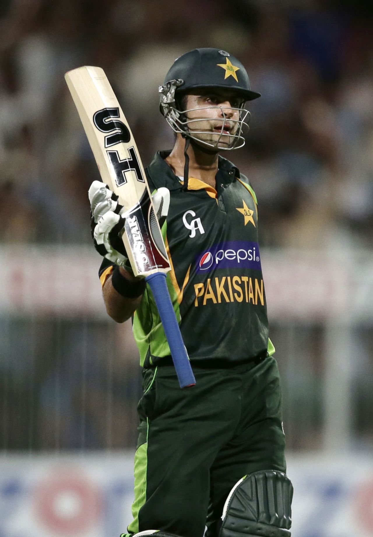 Ahmed Shehzad raises the bat after reaching his fifty, Pakistan v South Africa, 1st ODI, Sharjah, October 30, 2013