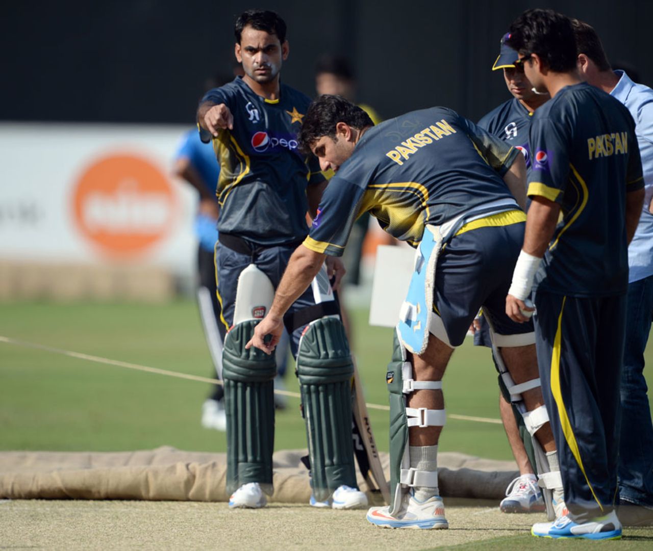 Misbah-ul-Haq and Mohammad Hafeez examine the pitch on the eve of the second ODI, Dubai, October 31, 2013