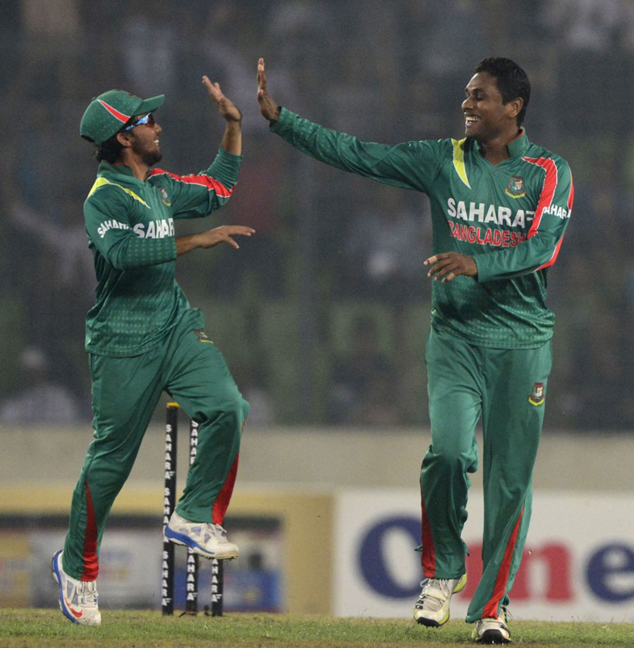 Mominul Haque and Sohag Gazi celebrate James Neesham's wicket, Bangladesh v New Zealand, 2nd ODI, Mirpur, October 31, 2013