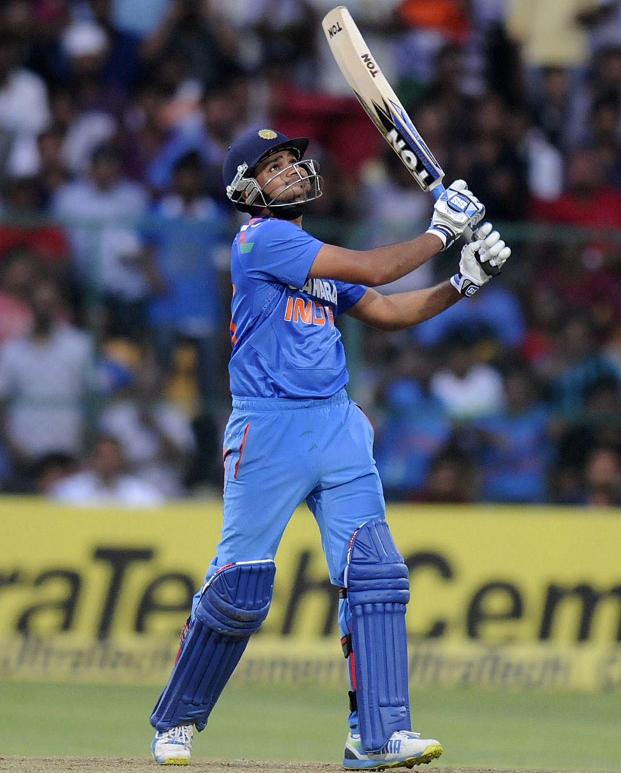 Rohit Sharma watches the ball soar into the evening sky, India v Australia, 7th ODI, Bangalore, November 2, 2013