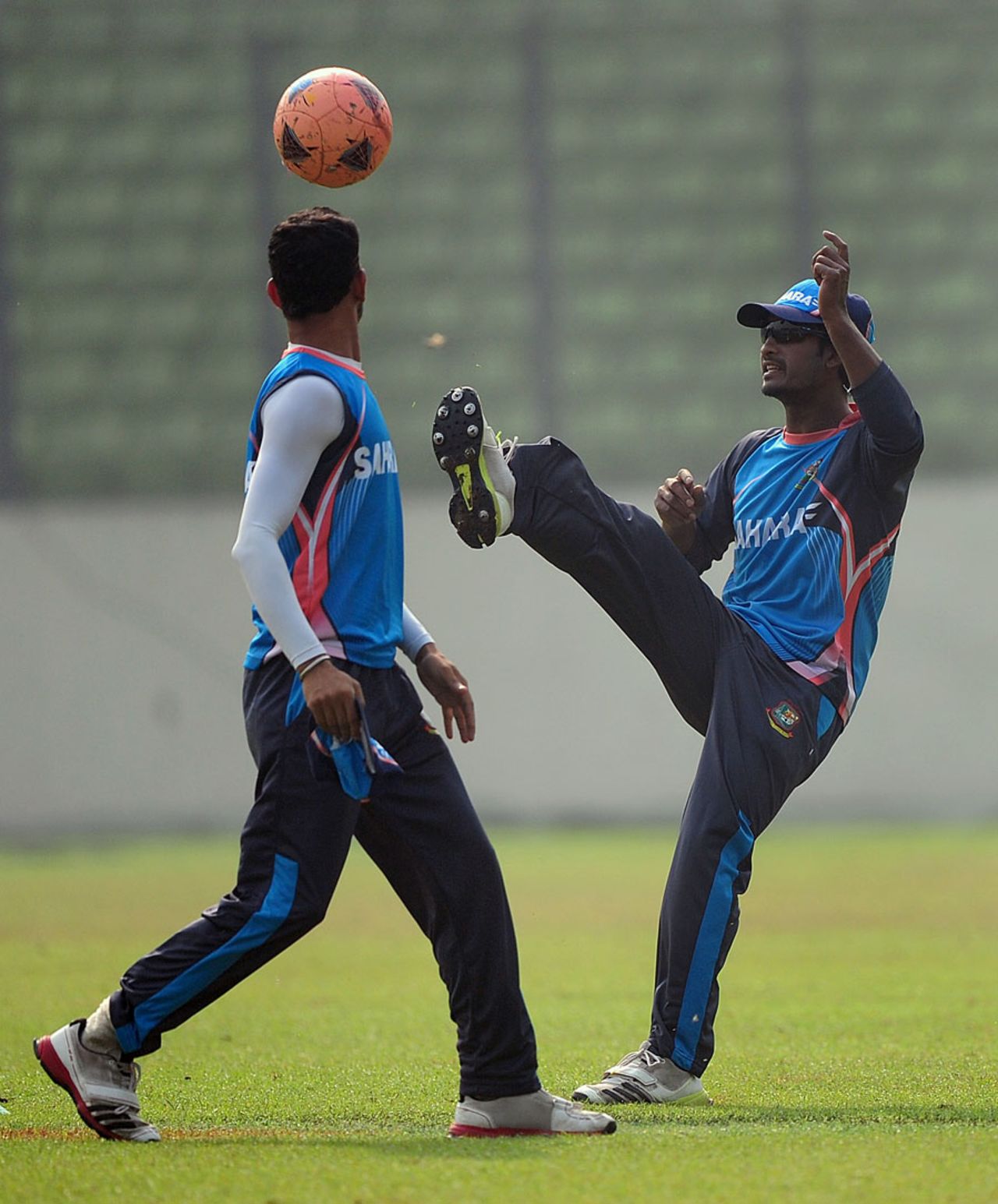 Naeem Islam (right) and Nasir Hossain warm up with a game of football, Dhaka, November 2, 2013