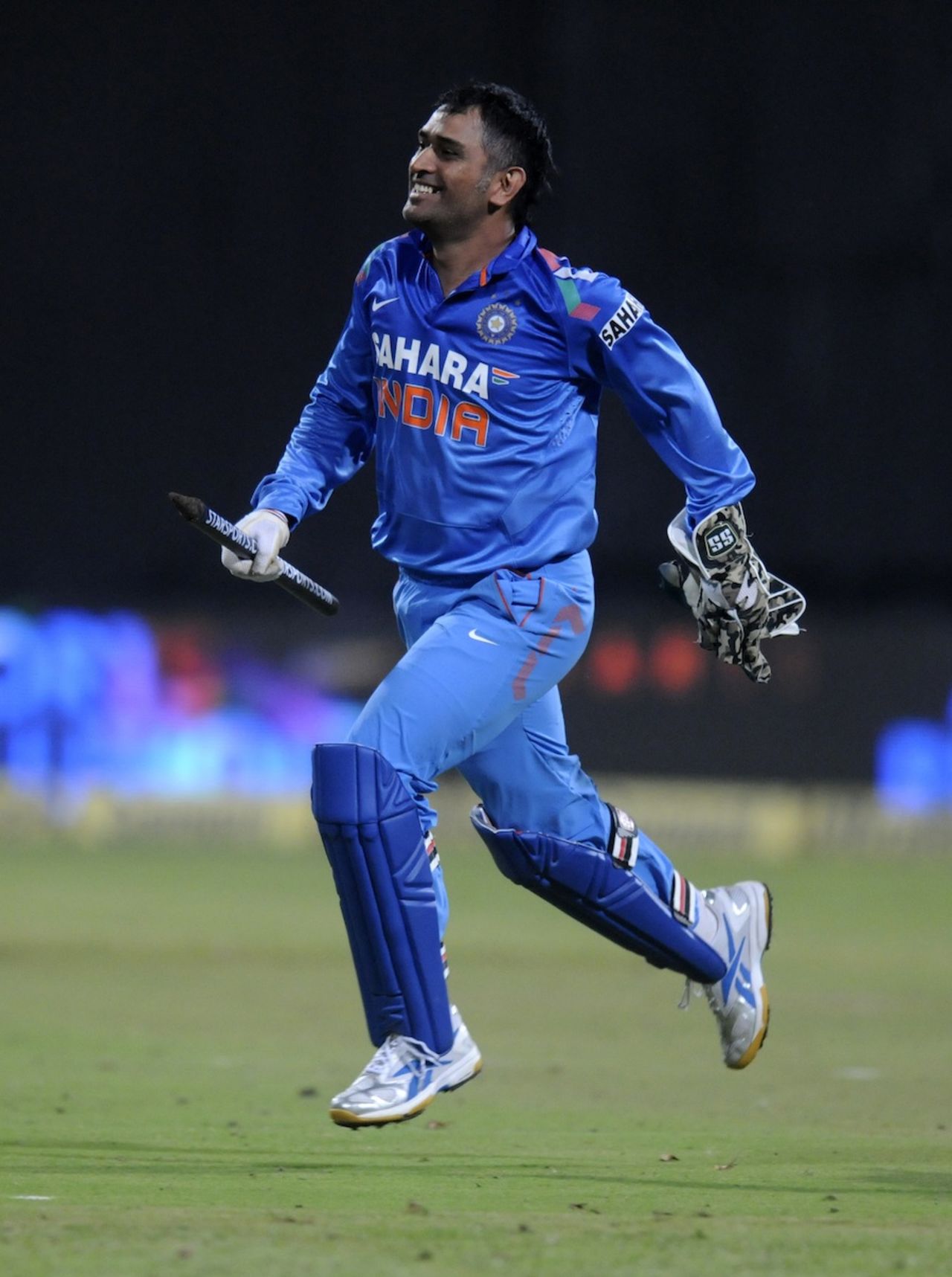 MS Dhoni runs to celebrate the series win, India v Australia, 7th ODI, Bangalore, November 2, 2013