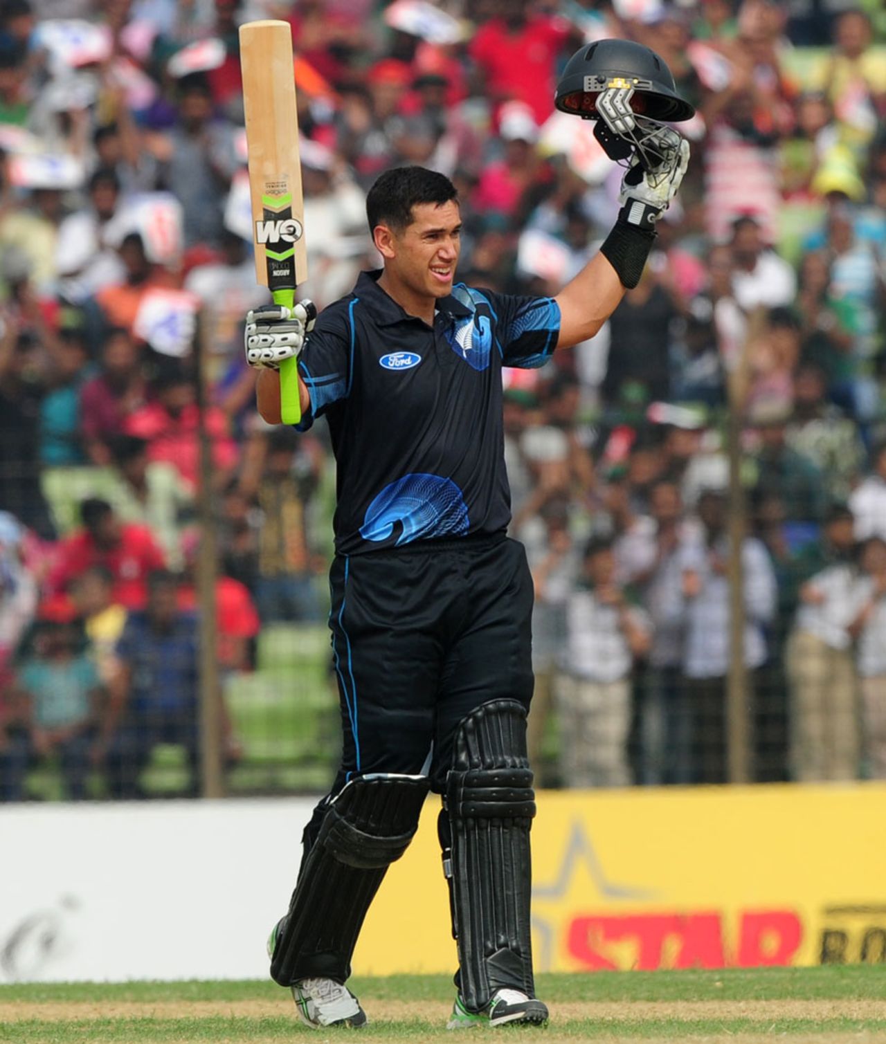 Ross Taylor raises his bat after scoring his eighth ODI hundred, Bangladesh v New Zealand, 3rd ODI, Fatullah, November 3, 2013