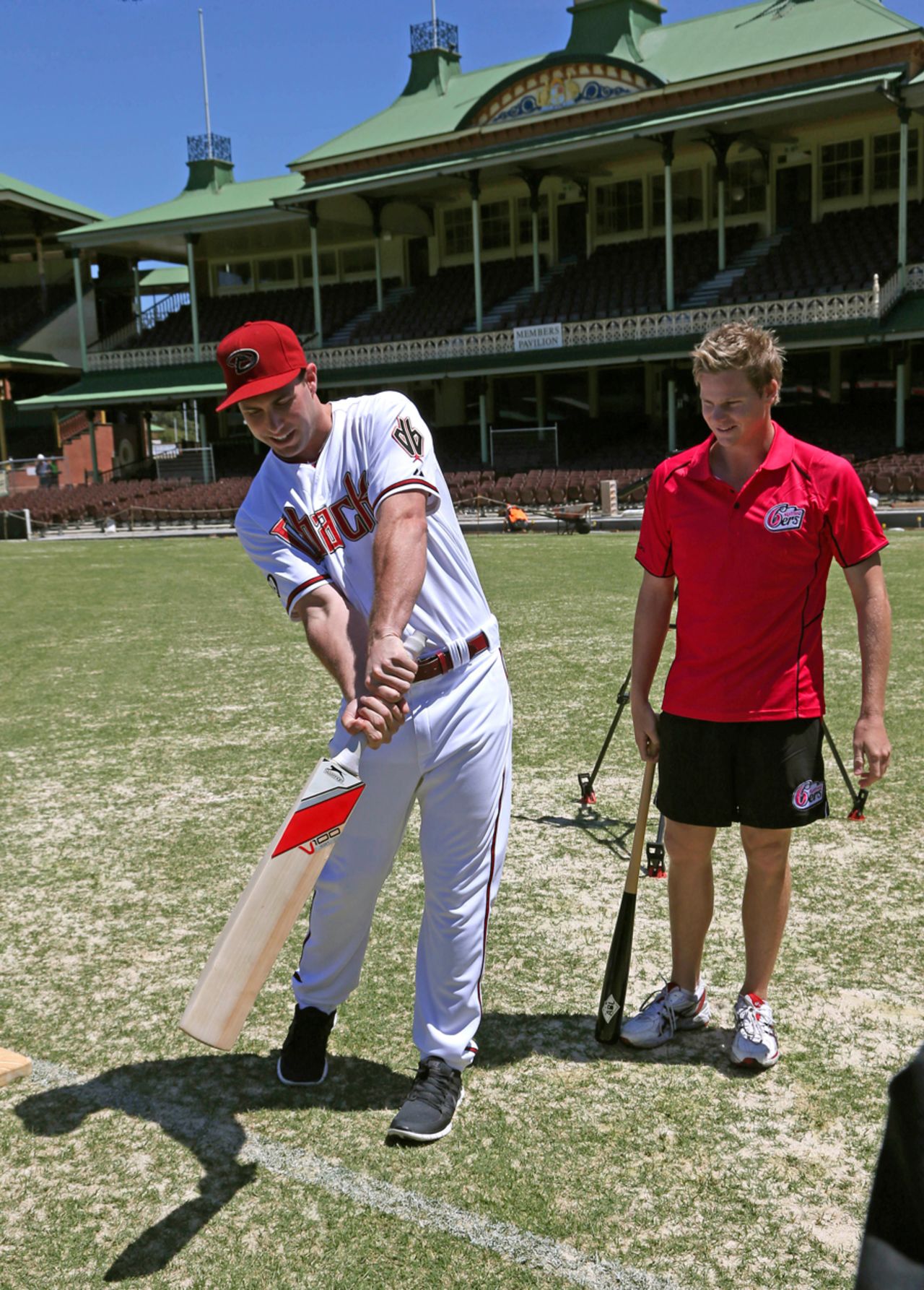 Steve Smith gives Major League Baseball player Paul Goldschmidt batting tips, Sydney, November 4, 2013