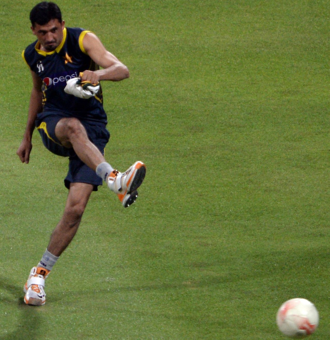 Junaid Khan plays football during a training session, Abu Dhabi, November 4, 2013