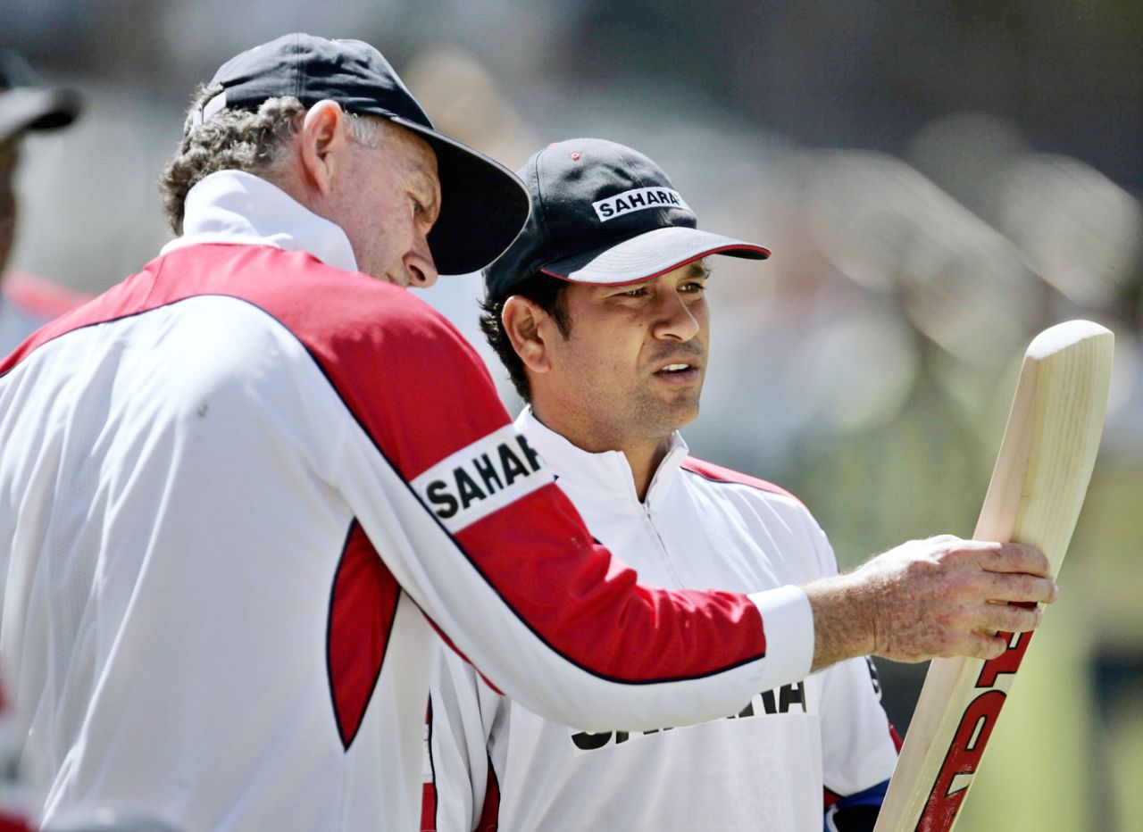 Coach Greg Chappell has a look at Sachin Tendulkar's bat, Hyderabad, November 15, 2005