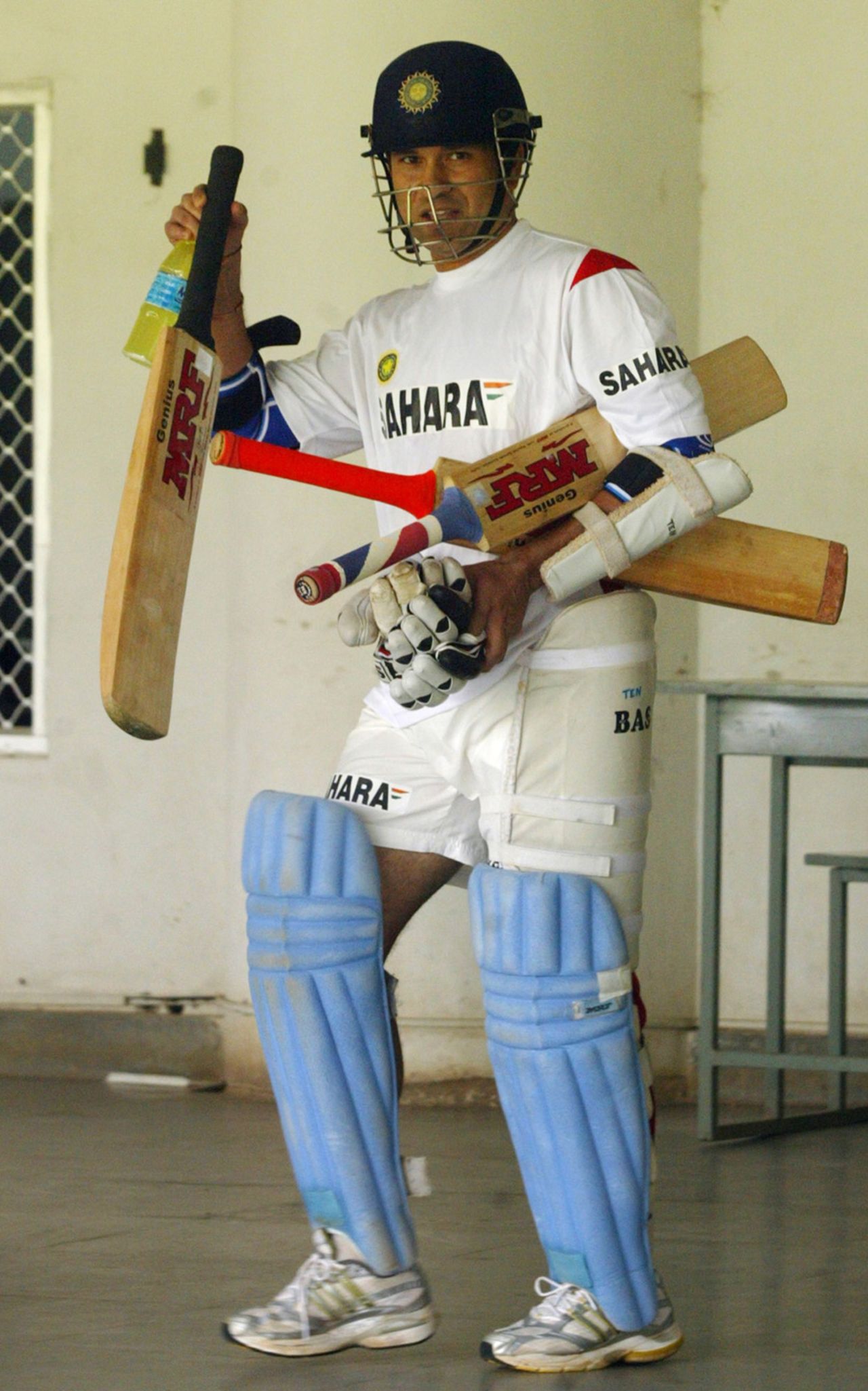 Sachin Tendulkar acknowledges fans before heading to a training session at the National Cricket Academy, Bangalore, October 20, 2005