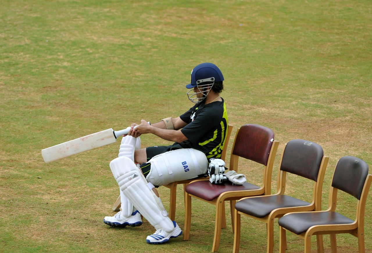 Sachin Tendulkar checks his bat during a practice session, Bangalore, August 29, 2012