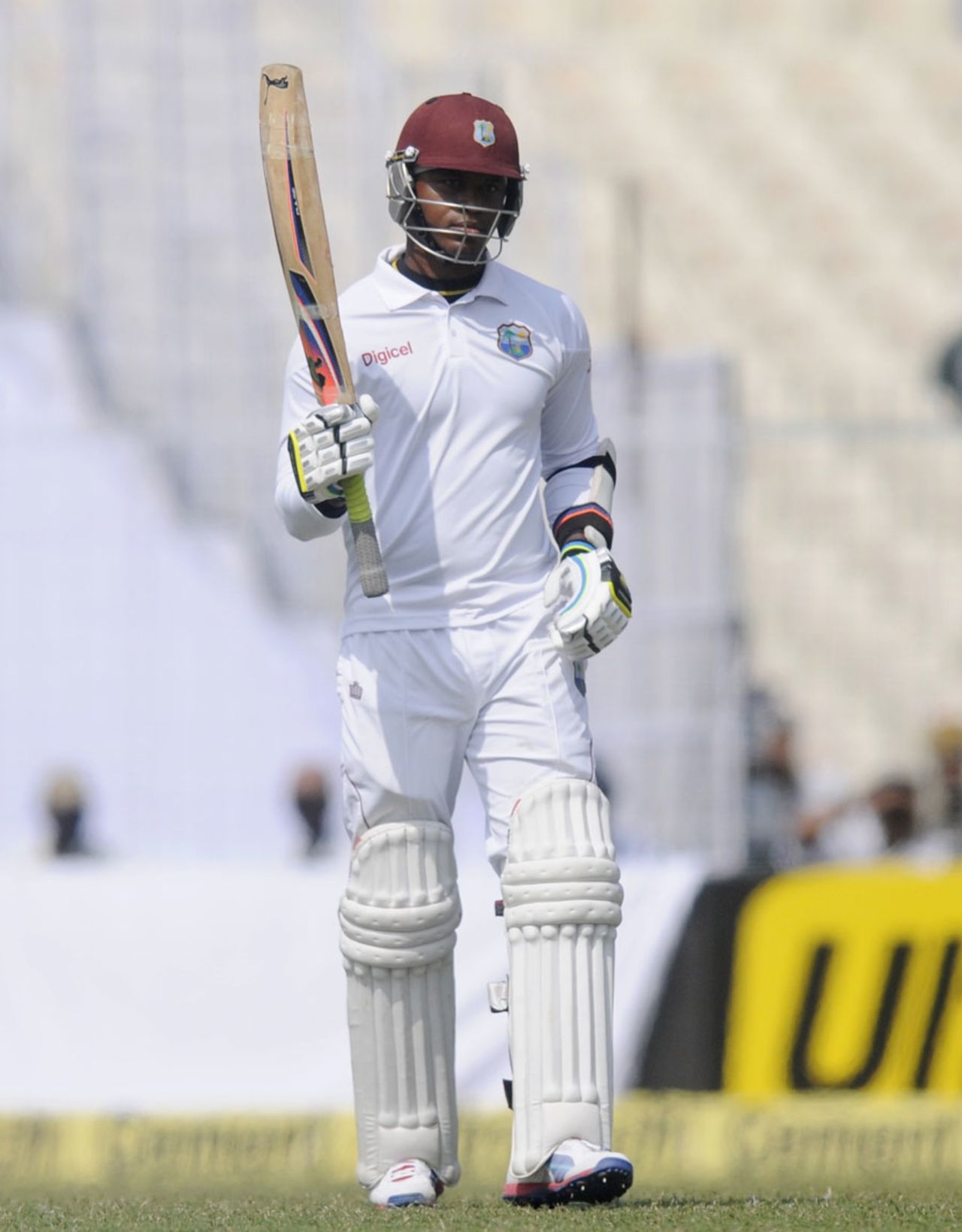 Marlon Samuels raises the bat after reaching his fifty, India v West Indies, 1st Test, Kolkata, 1st day, November 6, 2013