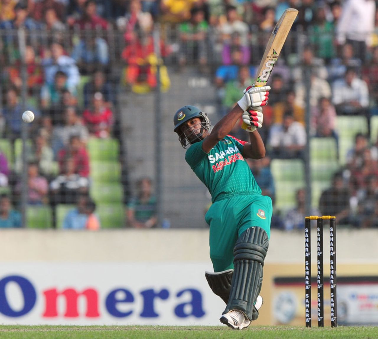 Naeem Islam plays a lofted shot down the ground, Bangladesh v New Zealand, only T20I, Mirpur, November 6, 2013