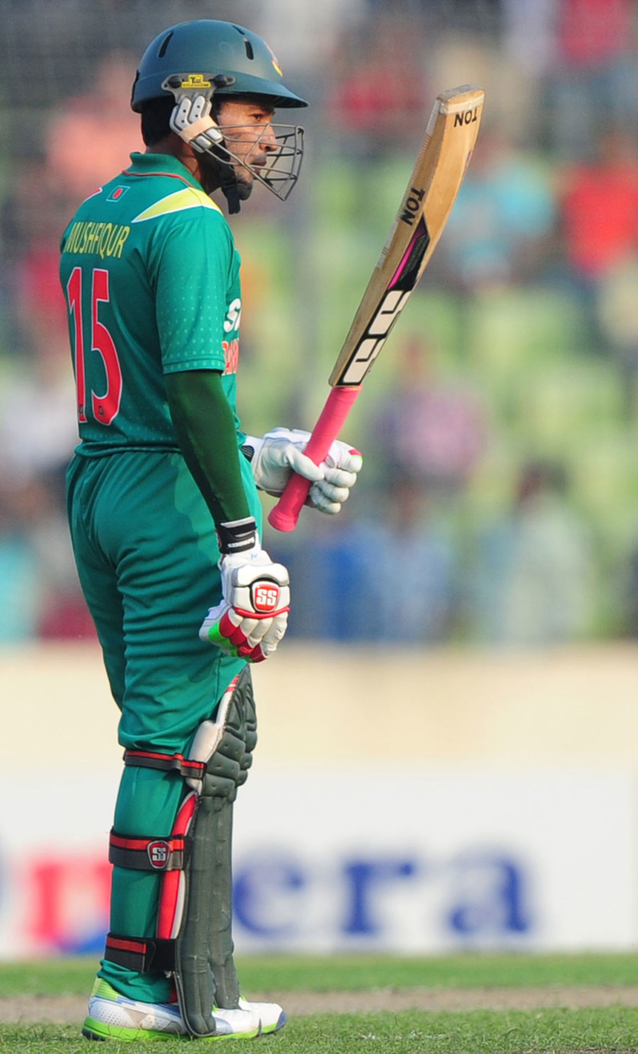 Mushfiqur Rahim raises his bat after scoring 50, Bangladesh v New Zealand, only T20I, Mirpur, November 6, 2013