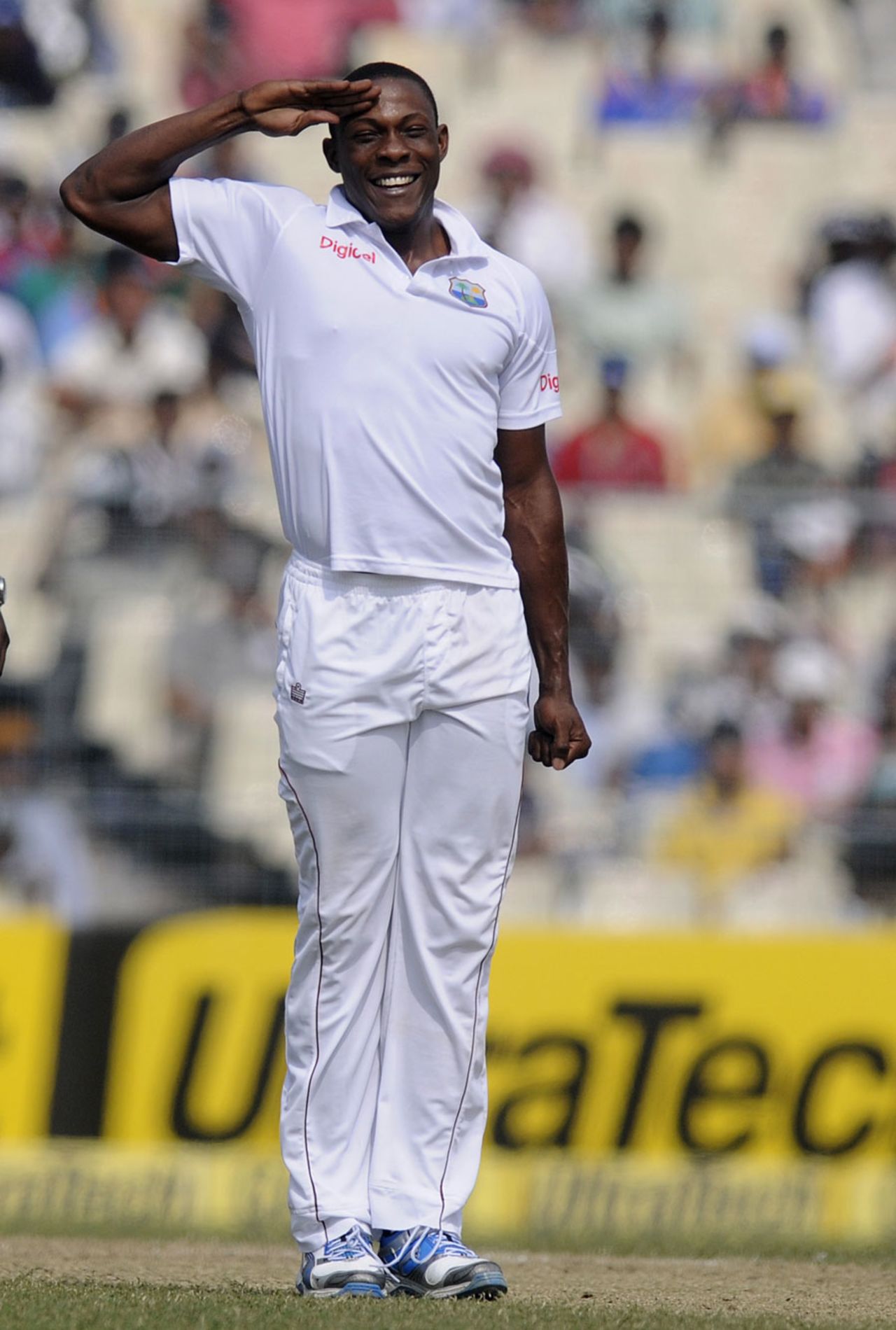 Sheldon Cottrell salutes towards the West Indies dressing room after dismissing Cheteshwar Pujara, India v West Indies, 1st Test, Kolkata, 2nd day, November 7, 2013