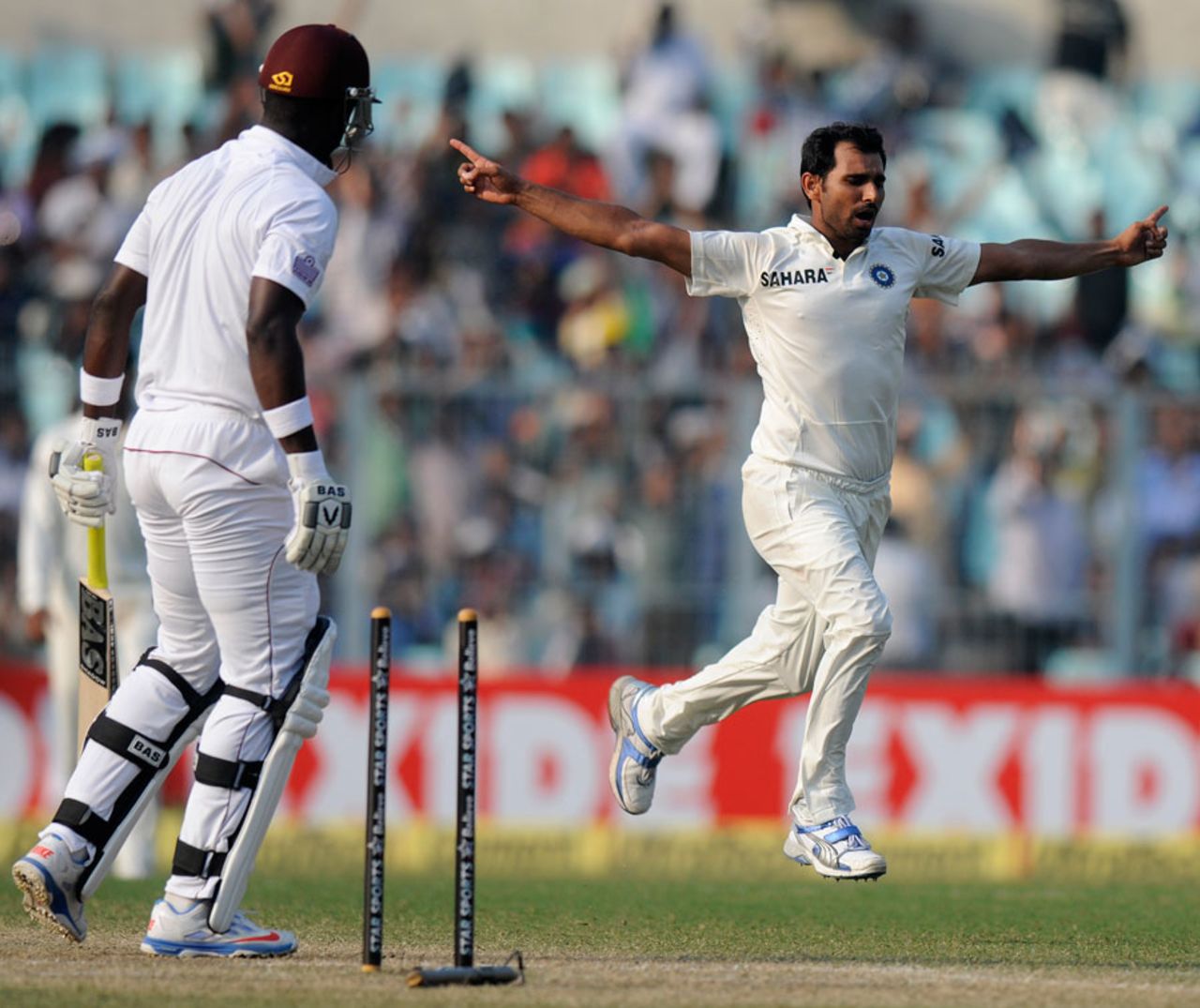 Mohammed Shami takes off after bowling Darren Sammy, India v West Indies, 1st Test, Kolkata, 3rd day, November 8, 2013