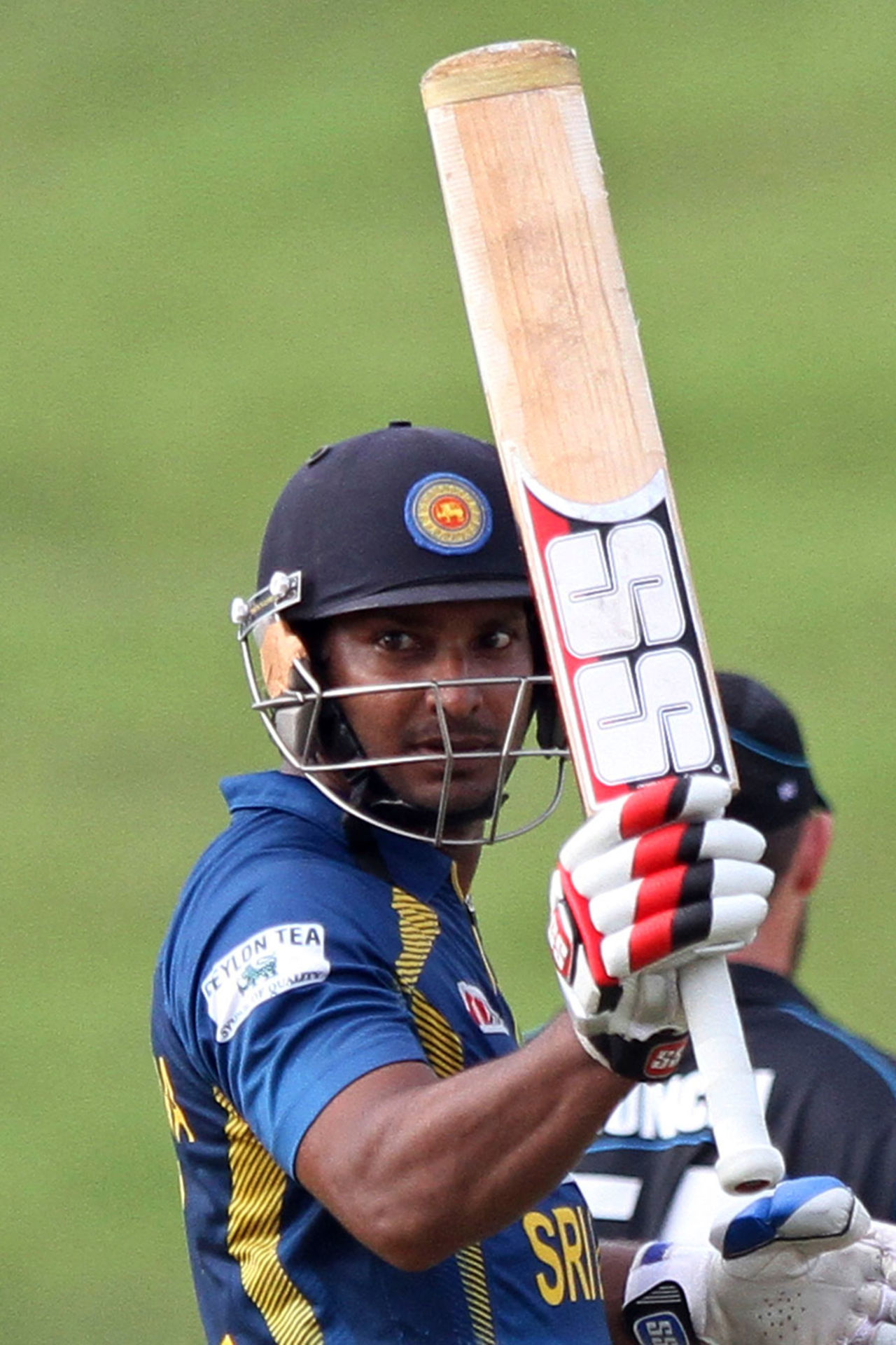 Kumar Sangakkara raises his bat to celebrate his fifty, Sri Lanka v New Zealand, 1st ODI, Hambantota, November 10, 2013