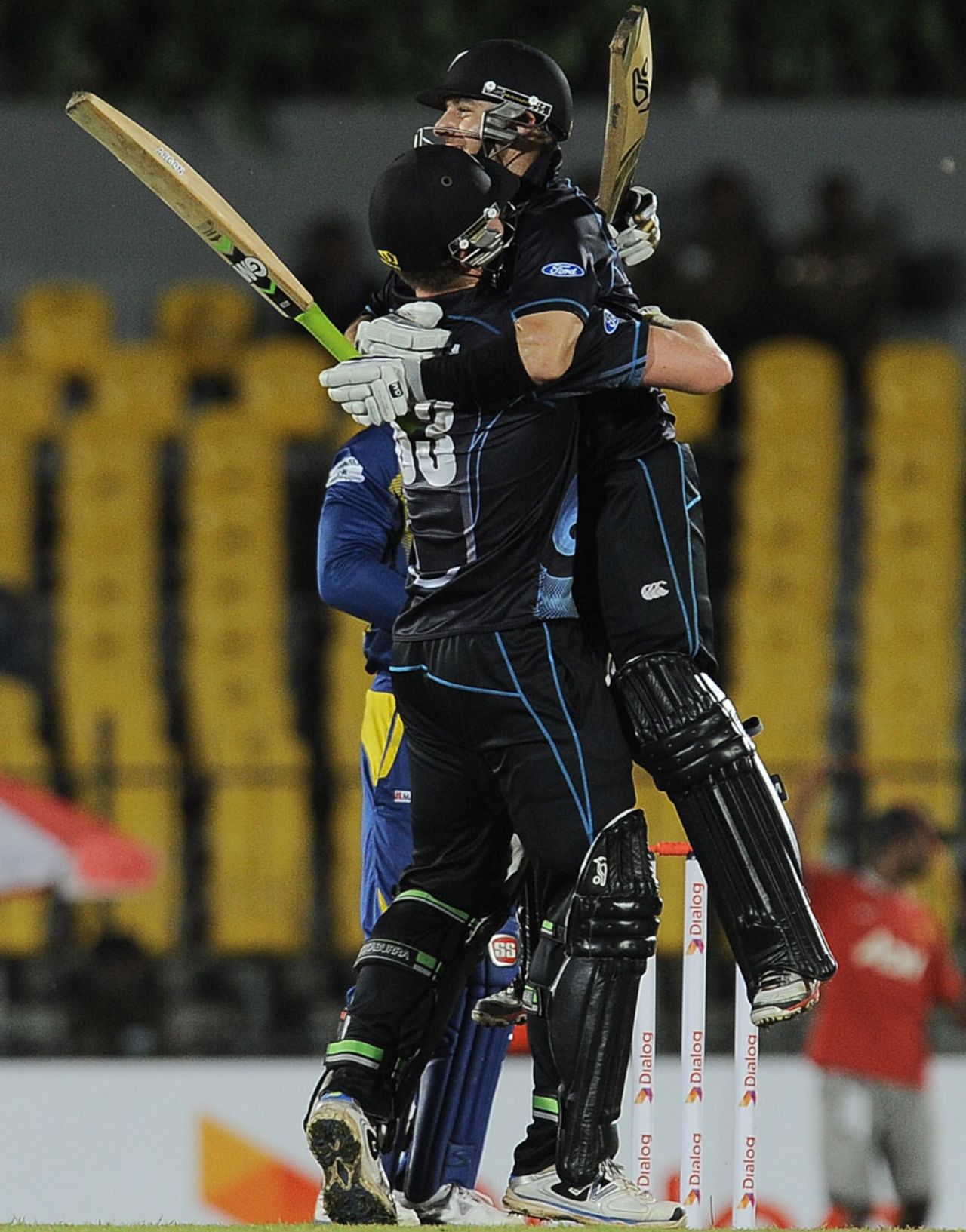 James Neesham and Nathan McCullum embrace after the latter hit the winning run with a six off the final ball, Sri Lanka v New Zealand, 2nd ODI, Hambantota, November 12, 2013