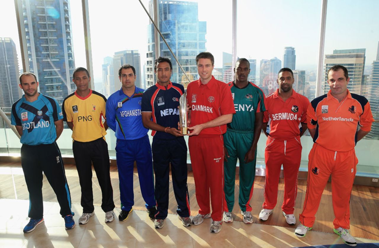 The various captains pose with World Twenty20 Qualifiers trophy, Dubai, November 14, 2013