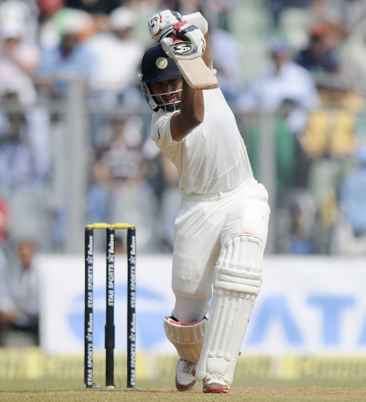 Not Tendulkar: Cheteshwar Pujara drives one down the ground, India v West Indies, 2nd Test, Mumbai, 2nd day, November 15, 2013