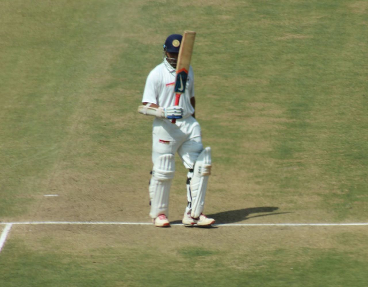 Parthiv Patel raises his bat after a half-century, Karnataka v Gujrat, Group A, Ranji Trophy, 2nd day, Bangalore, November 15, 2013