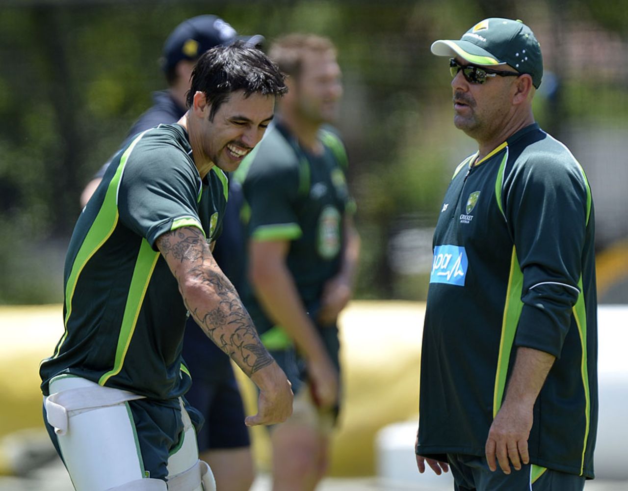 Darren Lehmann, sporting some extra facial hair, chats with Mitchell Johnson, Brisbane, November 15, 2013