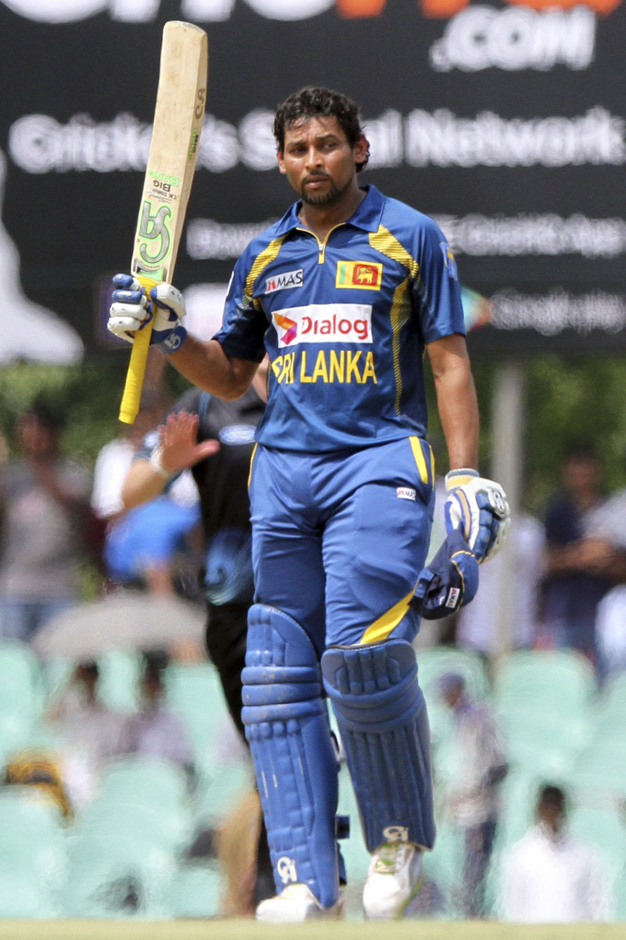 Tillakaratne Dilshan raises the bat after reaching his fifty, Sri Lanka v New Zealand, 3rd ODI, Dambulla, November 16, 2013