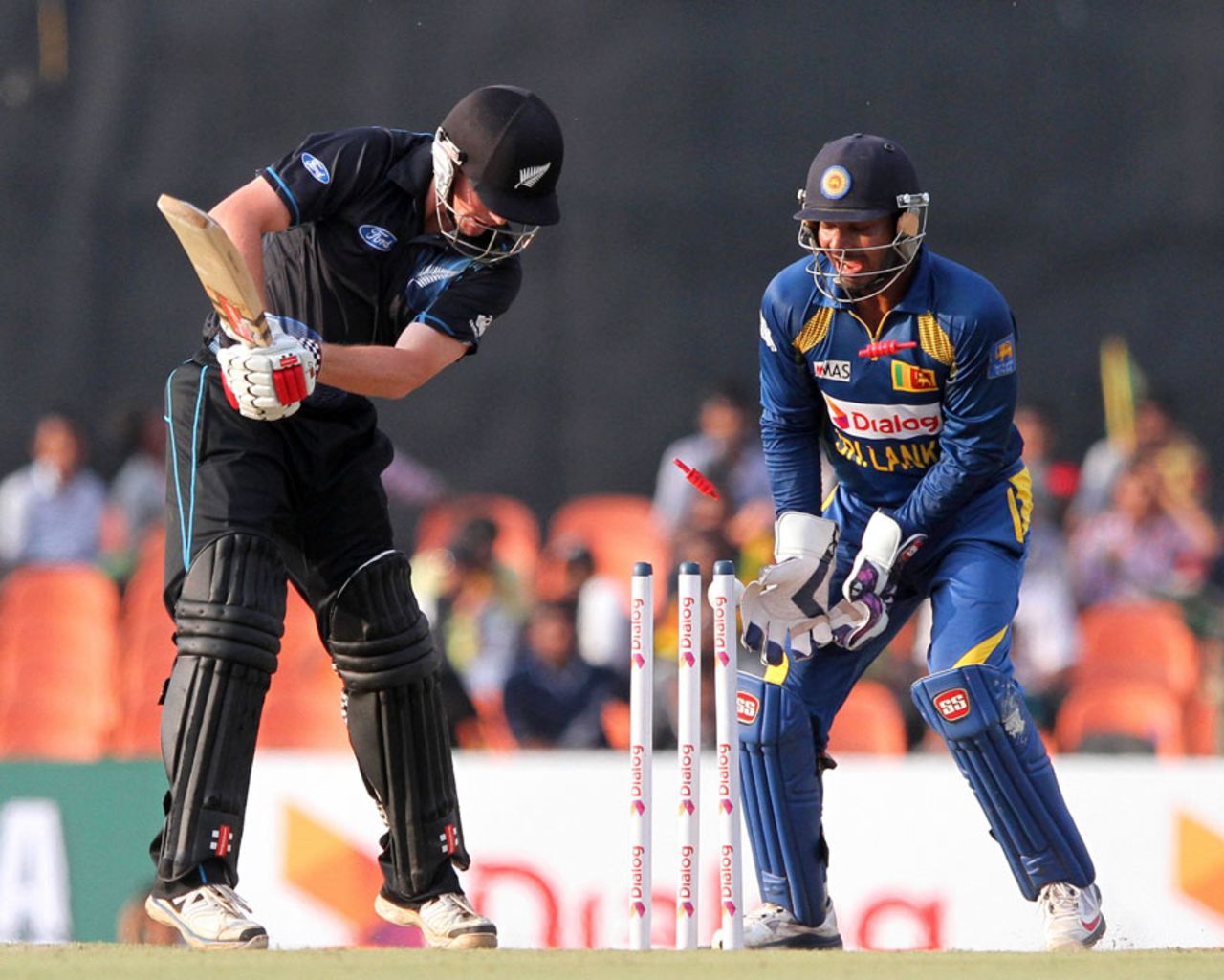 Colin Munro has his stumps disturbed , Sri Lanka v New Zealand, 3rd ODI, Dambulla, November 16, 2013