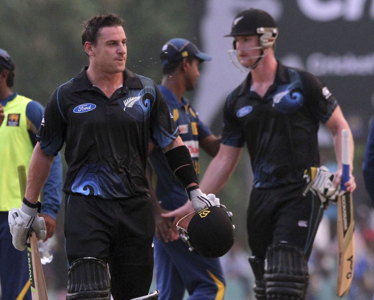 Nathan McCullum and James Neesham leave the field disappointed, Sri Lanka v New Zealand, 3rd ODI, Dambulla, November 16, 2013