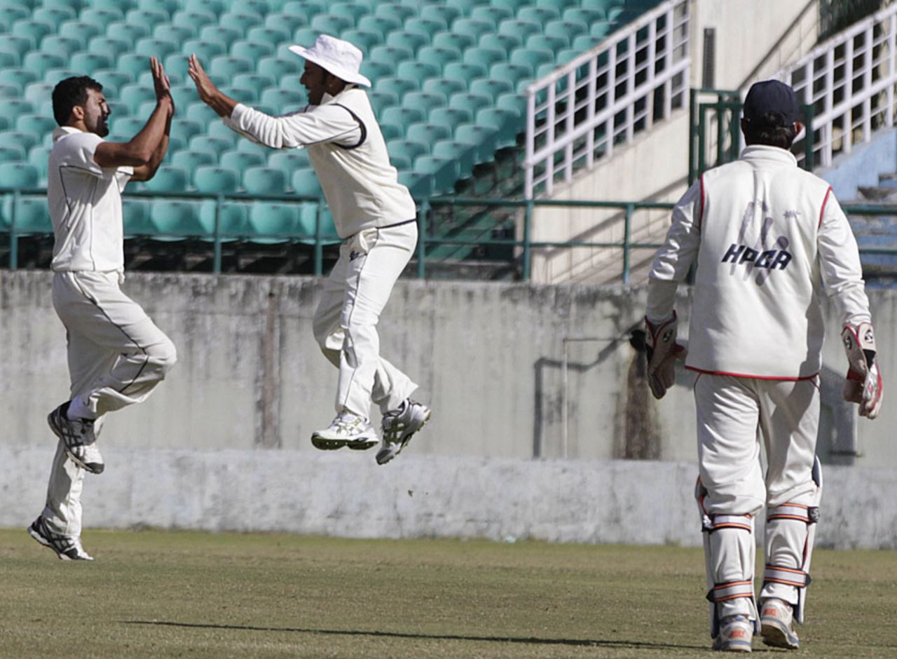 Rishi Dhawan celebrates a wicket with a team-mate, Himachal Pradesh v Jammu & Kashmir, Ranji Trophy, Group C, Dharamsala, November 16, 2013