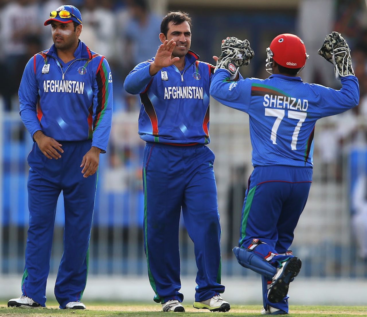 Samiullah Shenwari is congratulated after picking a wicket, PNG v Afghanistan, ICC World Twenty20 Qualifier, Group B, Sharjah, November 17, 2013