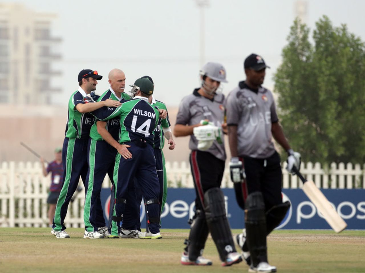The Ireland players celebrate a wicket, United Arab Emirates v Ireland, ICC World Twenty20 Qualifiers, Group A, Abu Dhabi, November 17, 2013