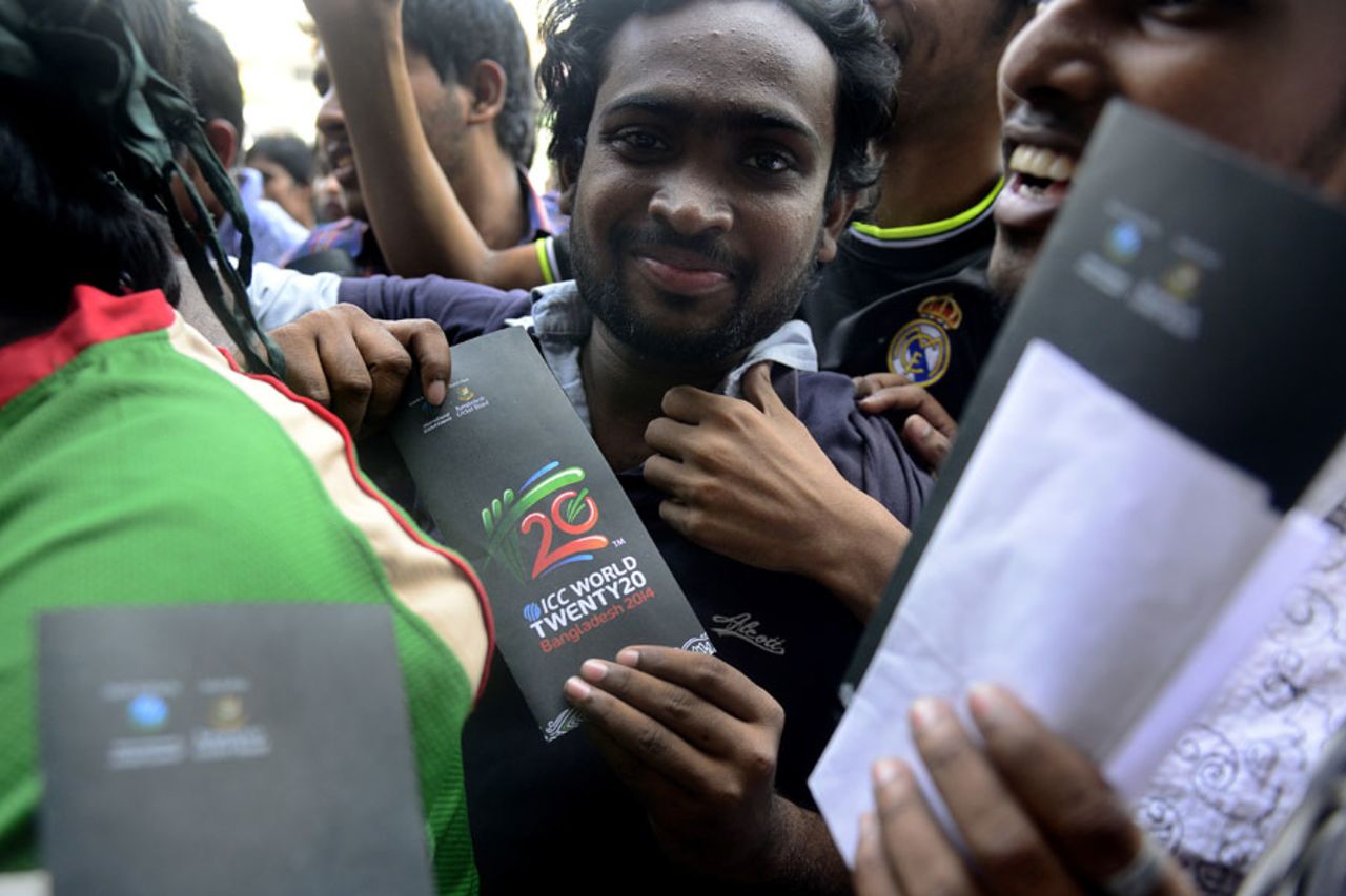 A fan displays his ticket for the 2014 World T20 tournament, Dhaka, November 17, 2013