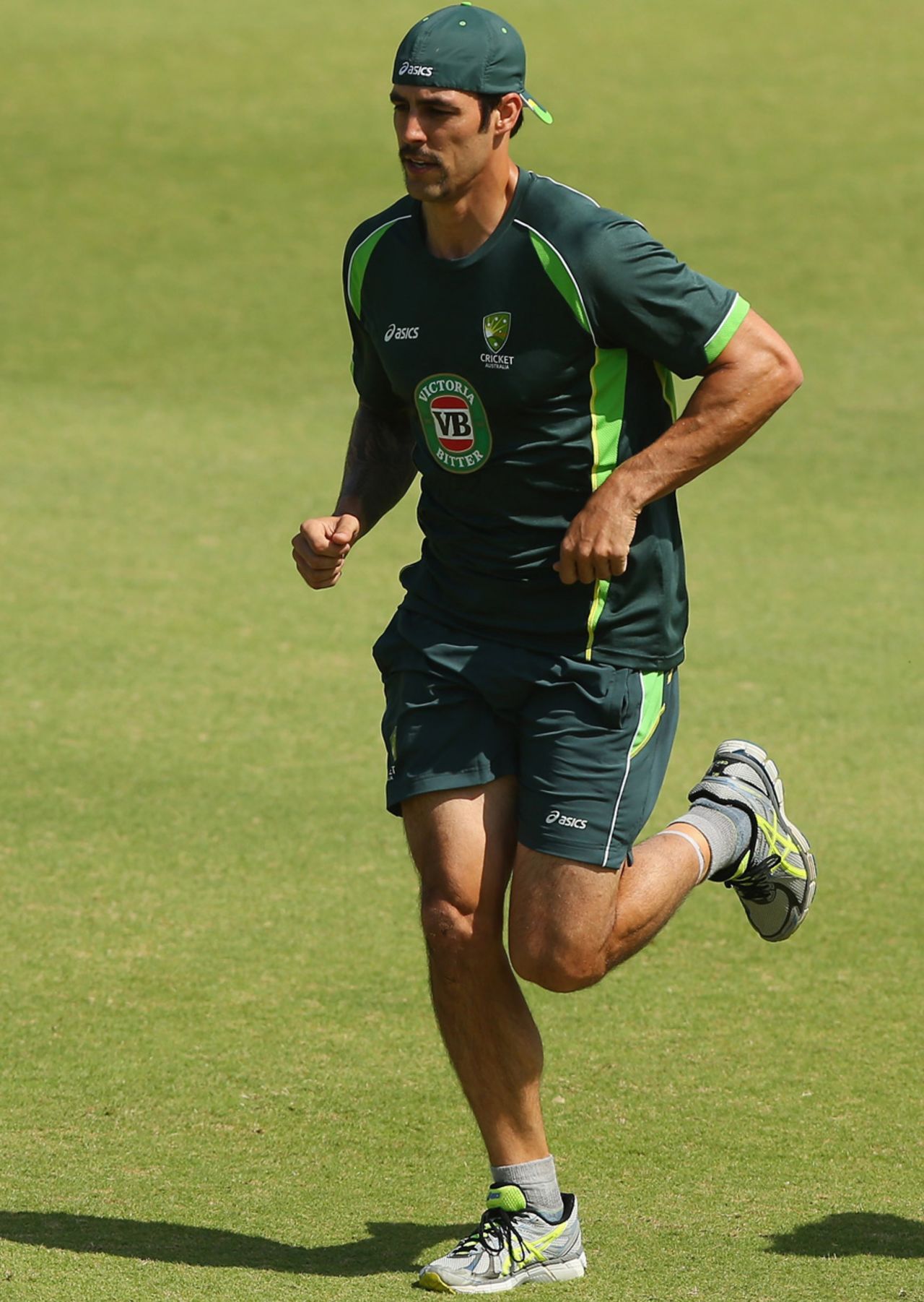 Mitchell Johnson has a jog during training, Brisbane, November 18, 2013