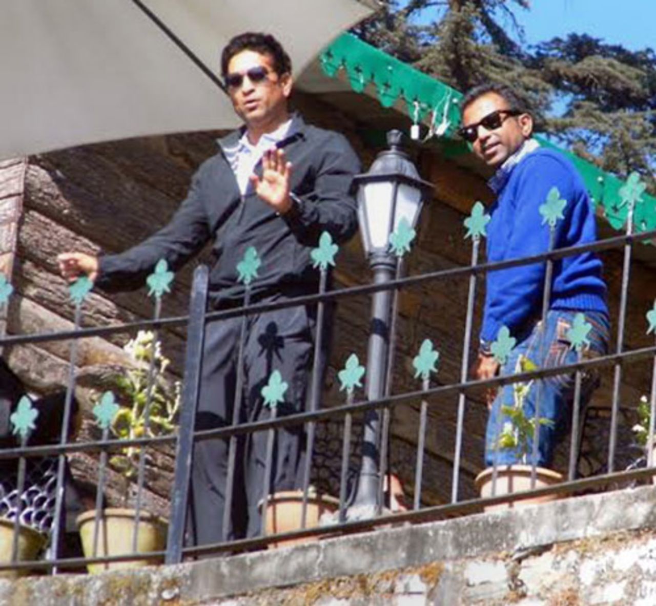 Sachin Tendulkar waves to the media from a private residence in the hill station of Mussoorie, Mussoorie, November 20, 2013