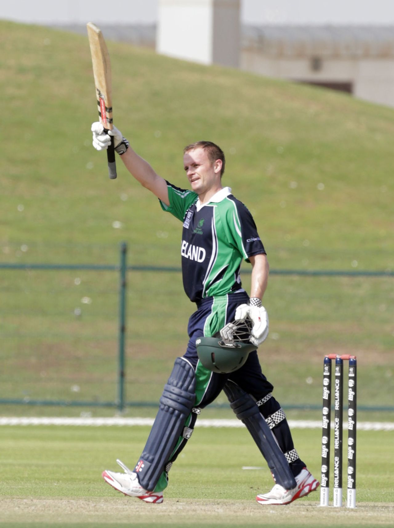 William Porterfield raises his bat after scoring his first T20 hundred, Ireland v United States of America, ICC World Twenty20 Qualifiers, Group A, Abu Dhabi, November 20, 2013