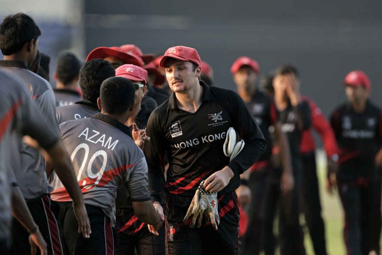 Jamie Atkinson of Hong Kong shakes hands with UAE after the Hong Kong v UAE match at the ICC World Twenty20 Qualifiers at the Zayed Cricket Stadium on November 19, 2013 in Abu Dhabi, United Arab Emirates. (Photo by Graham Crouch-IDI/IDI via Getty Images) 